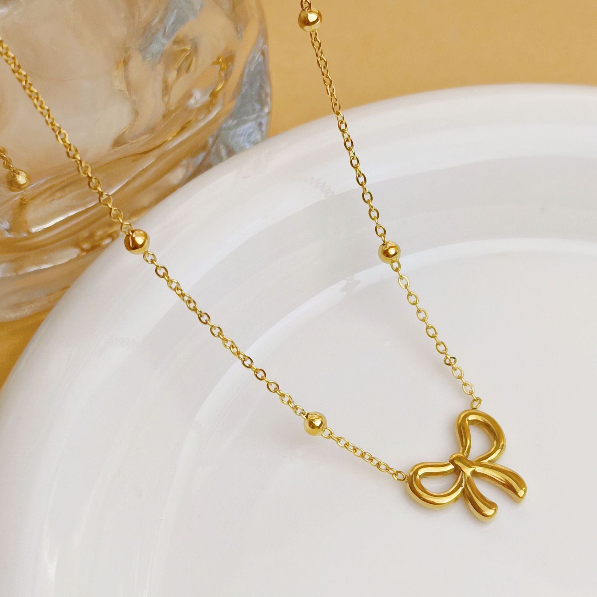 Golden Bow Charm Necklace