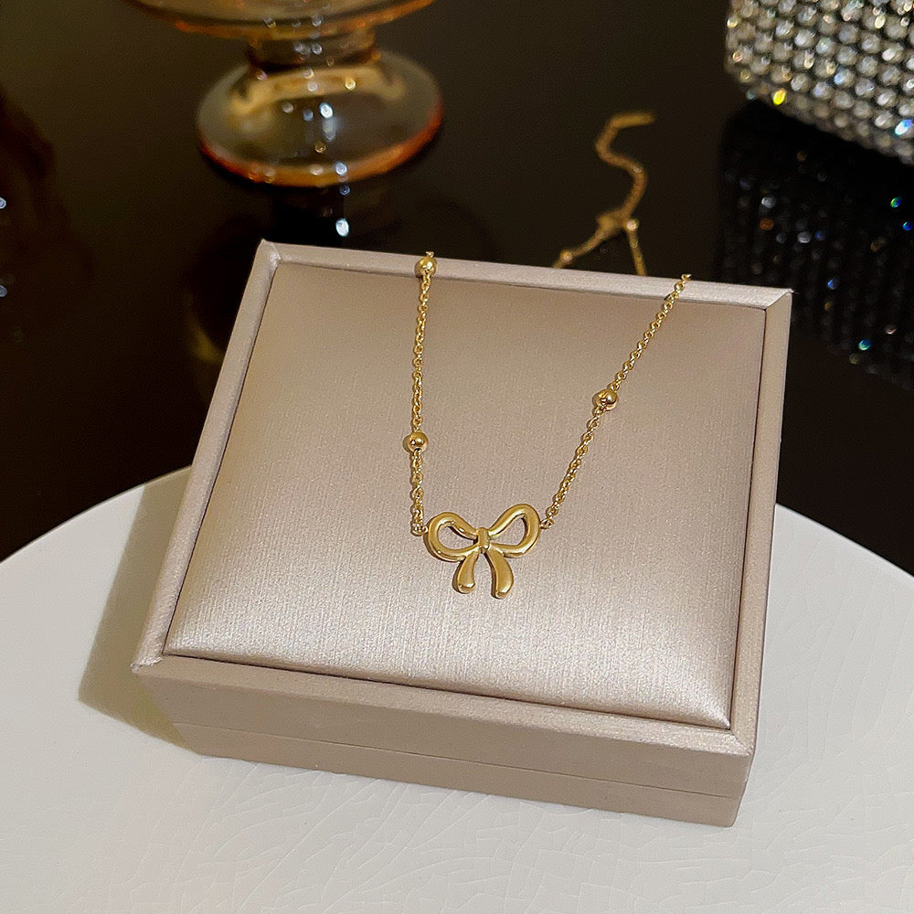 Golden Bow Charm Necklace