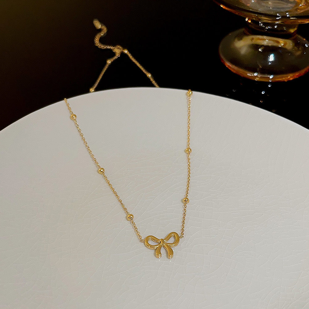Golden Bow Charm Necklace